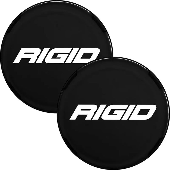 Pair of black and white logo wheel center caps for Ford depicted in Rigid Industries 360-Series 6in Light Covers.