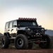 Jeep with four people on top and Rigid Industries 360-Series 6in light covers - Yellow pair