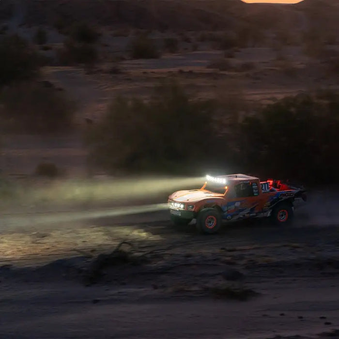 Rigid Industries 360-Series Laser Edition driving through desert at sunset