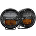 Pair of black LED headlights for Jeep illuminated in Rigid Industries 360-Series SAE Fog Yellow/White Pair.