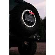 Close up of a tire on a vehicle with Rigid Industries Chase Tail Light Kit - Red.