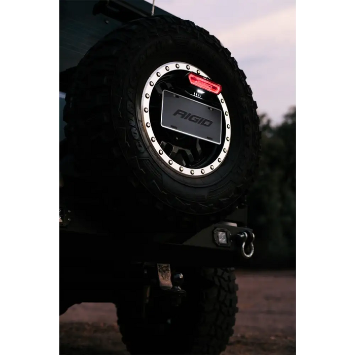 Close up of a tire on a vehicle with Rigid Industries Chase Tail Light Kit - Red.