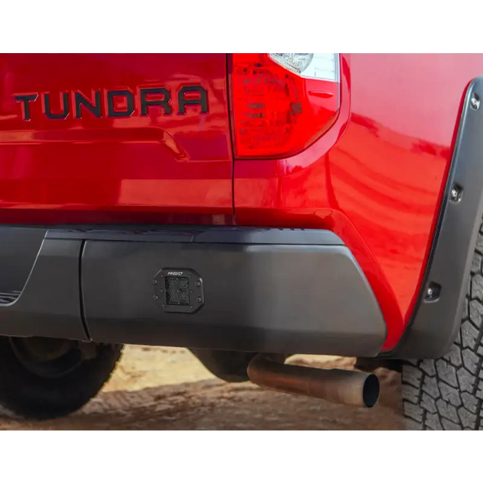 Red truck with black bumper shown in Rigid Industries D Series PRO Midnight Edition - Spot - Diffused - Pair.