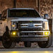 White truck parked in parking lot illuminated by Rigid Industries D-Series PRO SAE Fog Yellow Pair.