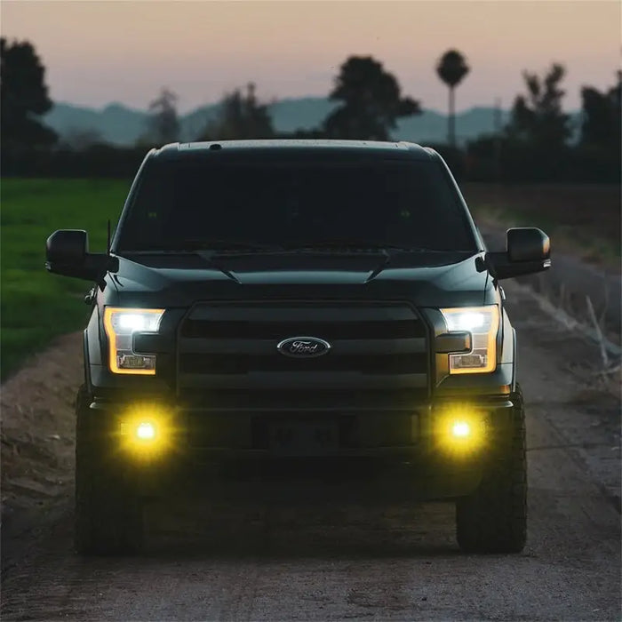 Rigid Industries D-Series SAE Fog Yellow/White Pair truck with yellow lights on headlights