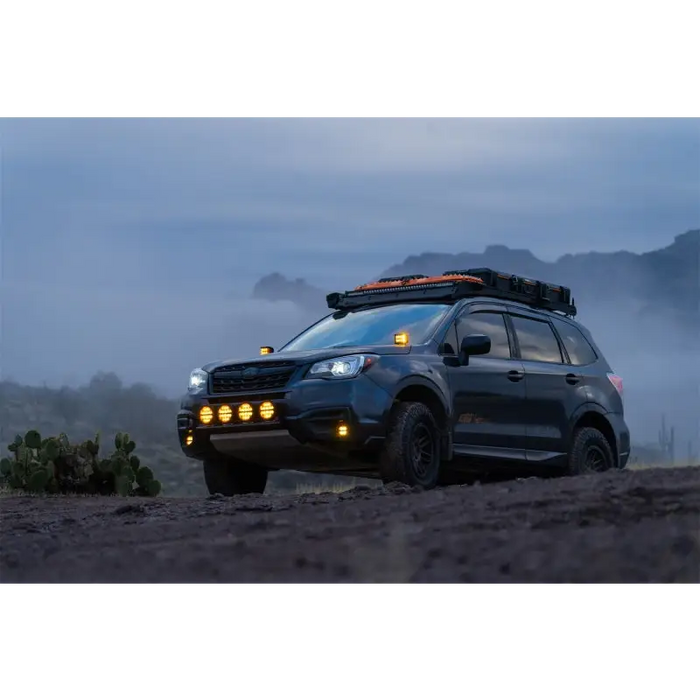 Black SUV driving through a dirt field - Rigid Industries D-SS Spot w/ Amber PRO Lens (Pair)