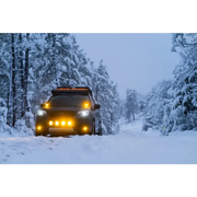 Driving car through snow covered forest featuring Rigid Industries D-SS Spot w/ Amber PRO Lens (Pair)