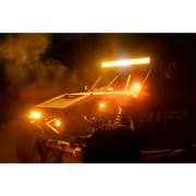 Yellow ATV with lights on in the dark, Rigid Industries E-Series 10in. Spot w/ Amber PRO Lens