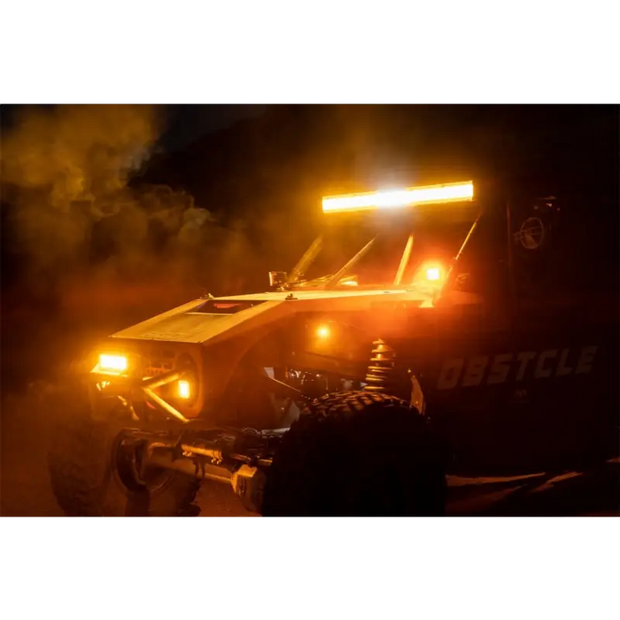 Yellow ATV with lights on in the dark, Rigid Industries E-Series 10in. Spot w/ Amber PRO Lens