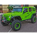 Green Jeep parked in lot with building in background, displayed with Rigid Industries Jeep JK A-Pillar Mount Kit - pillar mount kit.