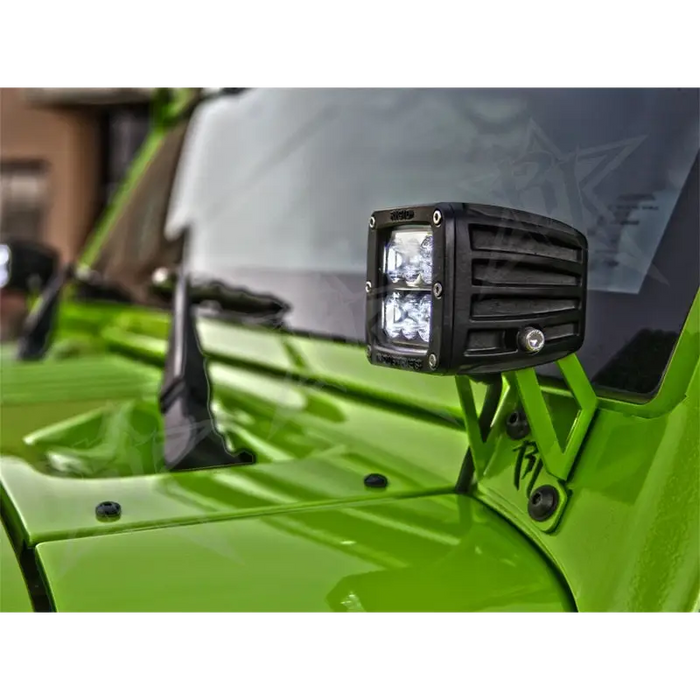 Green ATV light mounted on front of green ATV - Rigid Industries Jeep JK A-Pillar Mount Kit