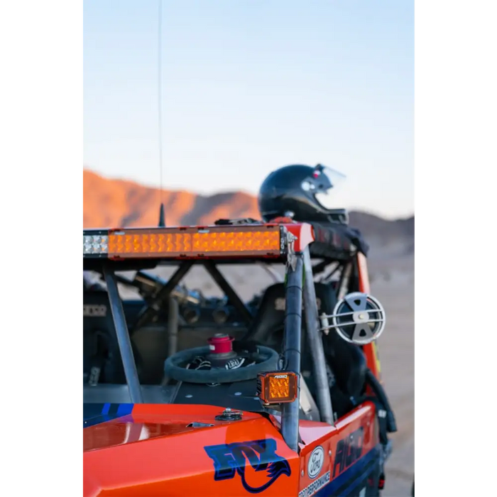 Rigid Industries Light Cover for E/RDS Amber PRO - 10in. Close up view of front of UTV with helmet on