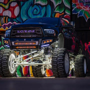 Black truck with big wheel and tires under Rigid Industries Radiance+ 20in. RGBW Light Bar