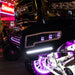 Rigid Industries Radiance+ Pod RGBW Pair with black truck and purple lights.