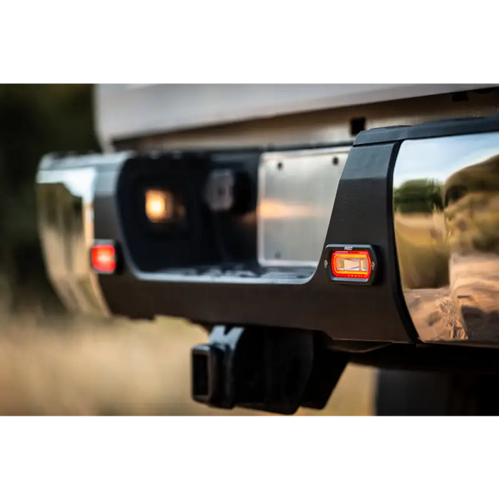 Rear view of vehicle with rear view mirror and Rigid Industries SR-L Series Spreader Light.