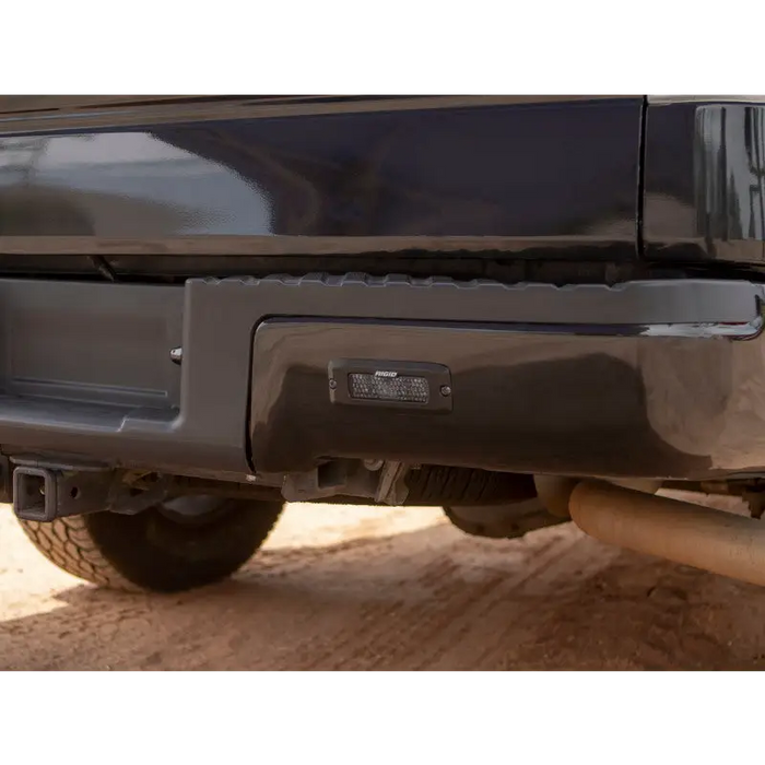 Black truck with black bumper and tail light next to Rigid Industries SR-Q Series PRO Midnight Edition - Spot - Diffused - Pair