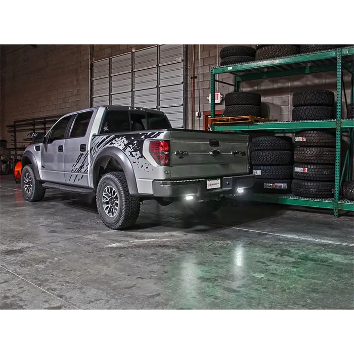 Rigid Industries SRQ Back Up Light Kit with Tire Rack in Warehouse