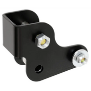 Black plastic bracket mounted on white background for RockJock 2021+ Bronco Geometry Correction Axle Bracket for Rear Trac Bar.