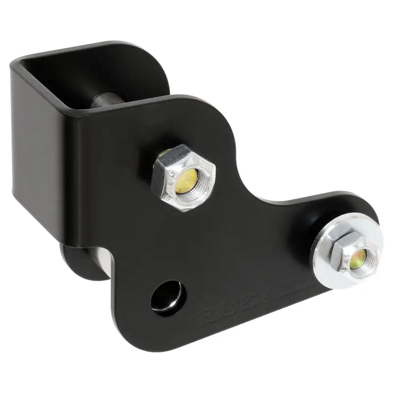 Black plastic bracket mounted on white background for RockJock 2021+ Bronco Geometry Correction Axle Bracket for Rear Trac Bar.