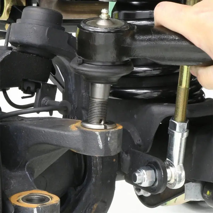 Person holding RockJock JK Currectlync Steering System with Flipped Drag Link and Tie Rod