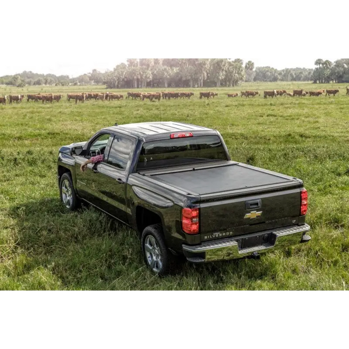 Black roll n lock truck bed cover on Toyota Tacoma.