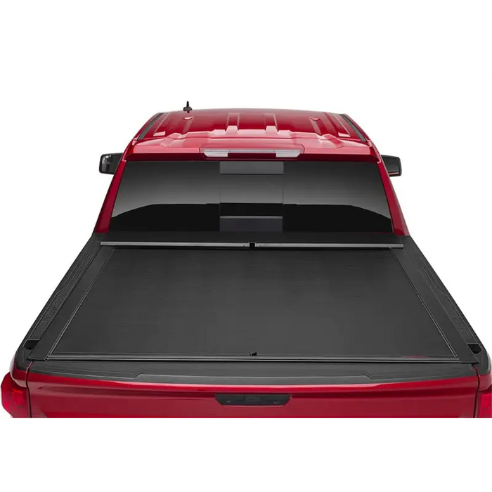 Red truck with open top, Roll-N-Lock retractable tonneau cover for Toyota Tacoma Crew Cab SB.