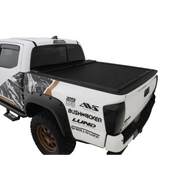 Black and white Roll-N-Lock truck bed cover for 16-18 Toyota Tacoma Crew Cab SB.