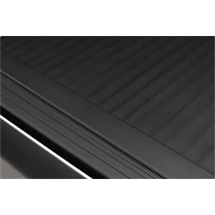 Black door with white handle, part of Roll-N-Lock A-Series retractable tonneau cover for Toyota Tacoma Double Cab.