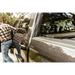 Man walking towards a truck with Roll-N-Lock retractable tonneau cover.