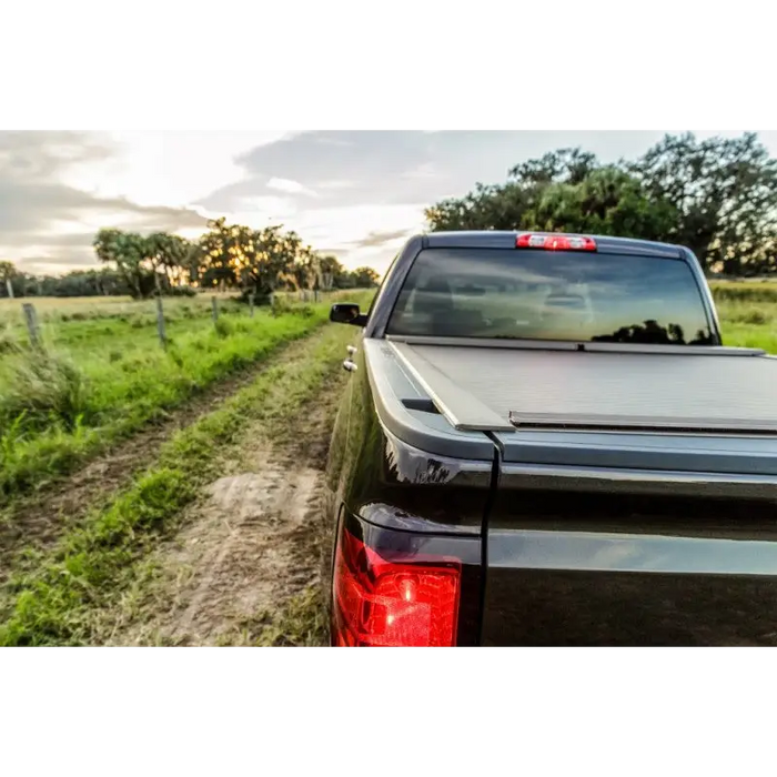 Red light truck with Roll-N-Lock tonneau cover.