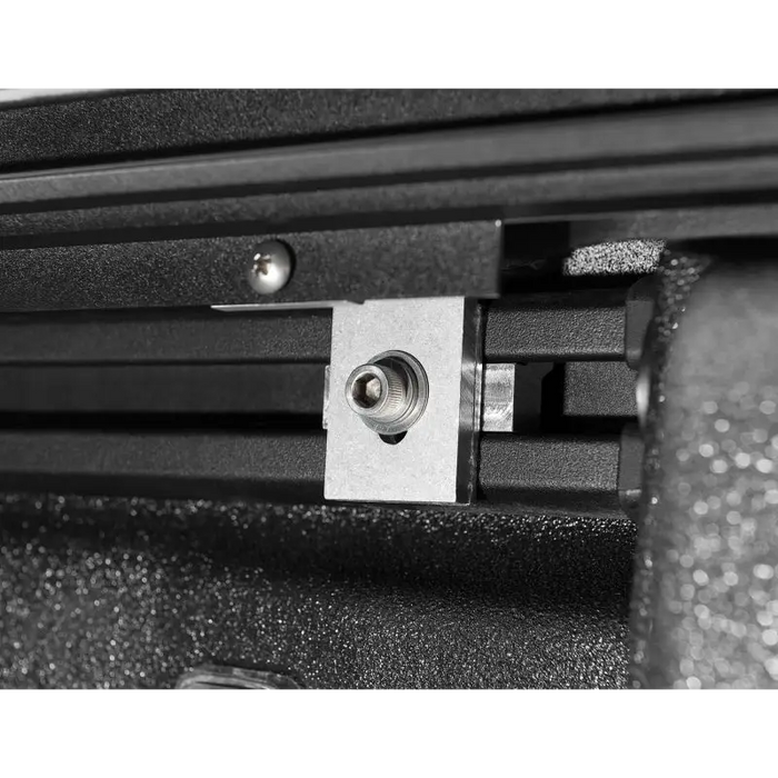 Metal latch attached to Roll-N-Lock 2020 Jeep Gladiator 5ft bed M-Series retractable tonneau cover.