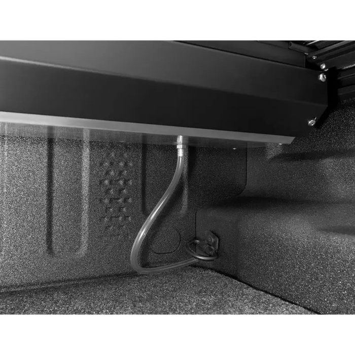 Roll-N-Lock M-Series Retractable Tonneau Cover attached to rear bumper of vehicle