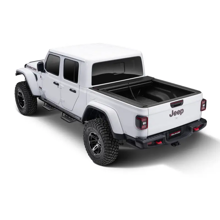 White truck with black Roll-N-Lock retractable tonneau cover
