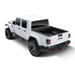 White truck with black Roll-N-Lock retractable tonneau cover