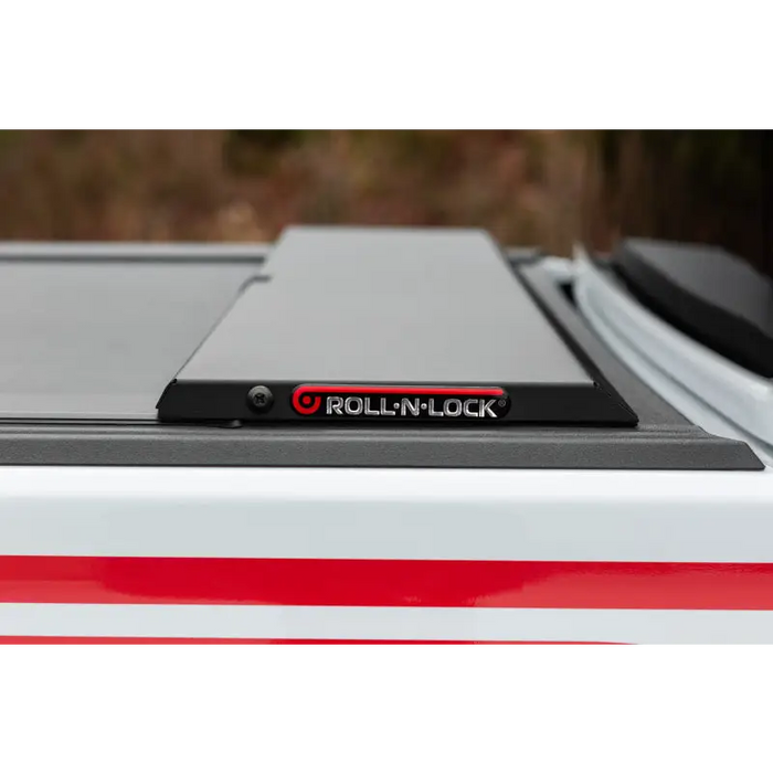 Roll-N-Lock retractable tonneau cover for Jeep Gladiator truck bed rack