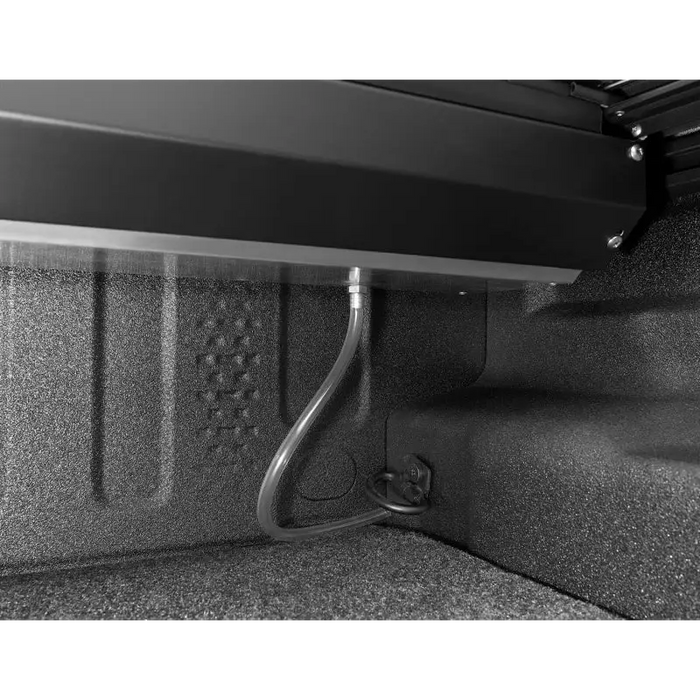 Roll-N-Lock M-Series retractable tonneau cover for 2020 Jeep Gladiator showing rear bumper bracket.