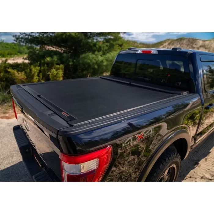 Roll-N-Lock retractable truck bed cover on Jeep Gladiator with black bed cover