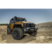 Rugged Ridge Jeep Wrangler XHD Snorkel Kit on dirt road with air intake pre filter low.