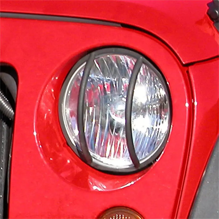 Red motorcycle headlight on Rugged Ridge 07-18 Jeep Wrangler JK Black Headlight Euro Guards
