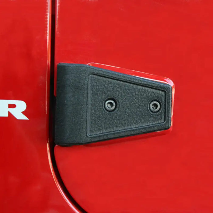 Red Jeep Wrangler door handle with white arrow - Rugged Ridge hinge cover kit