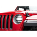 Red Jeep with headlight guards displayed on white background.