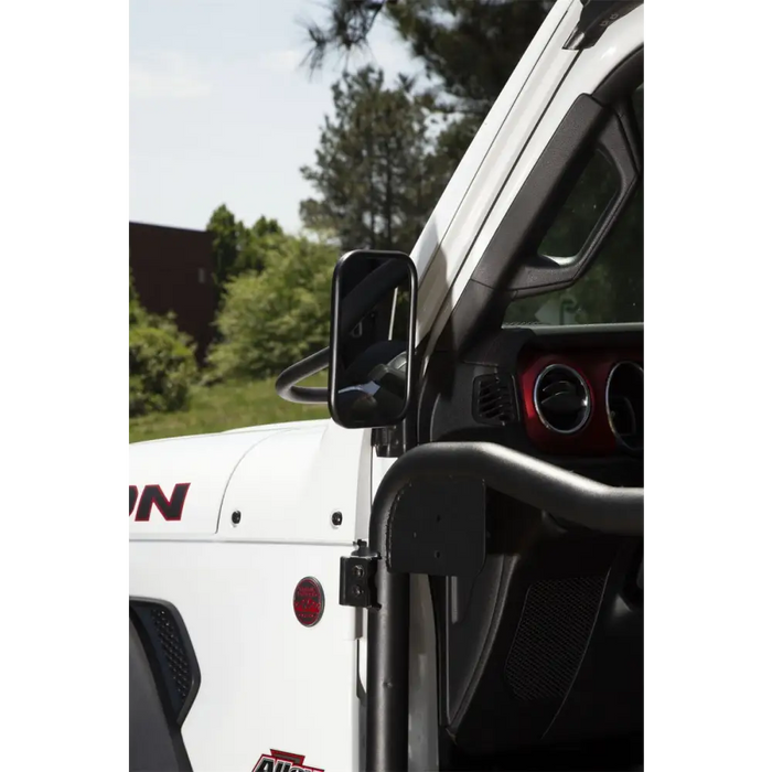 White truck with door open featuring Rugged Ridge trail mirrors.