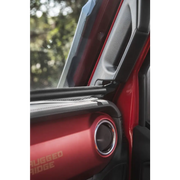 Rugged Ridge black dash bar on red car door handle
