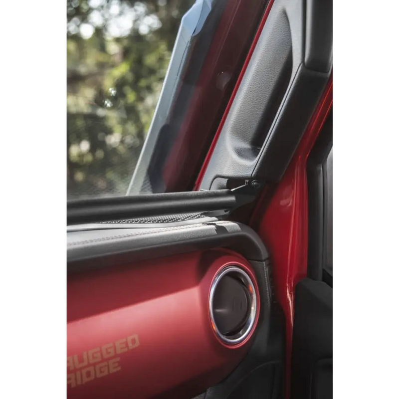 Rugged Ridge black dash bar on red car door handle
