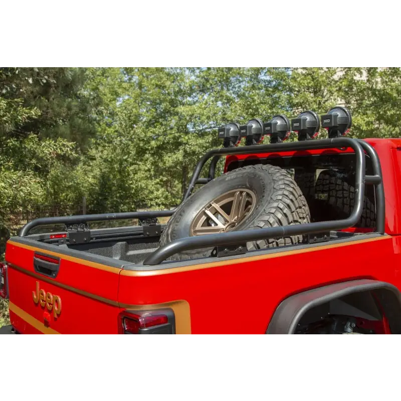 Red Jeep featuring Rugged Ridge spare tire carrier hinge.