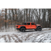 Jeep Gladiator driving on snowy road with Max Terrain fender flares.