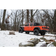 Jeep parked in snow with Rugged Ridge Max Terrain Fender Flares