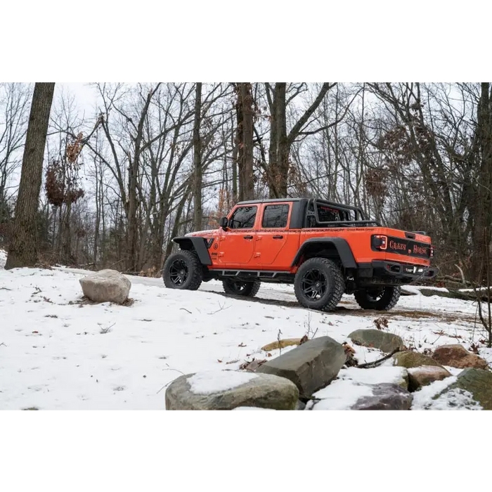 Jeep parked in snow with Rugged Ridge Max Terrain Fender Flares