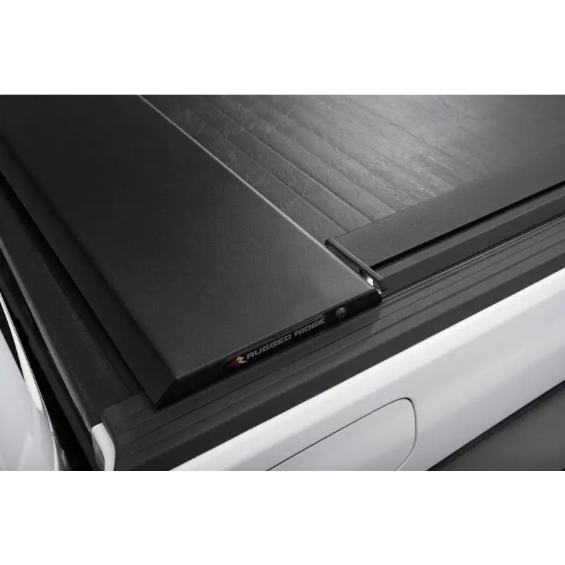 Rugged Ridge Armis Tonneau Cover w/Max Track protecting sunroad.