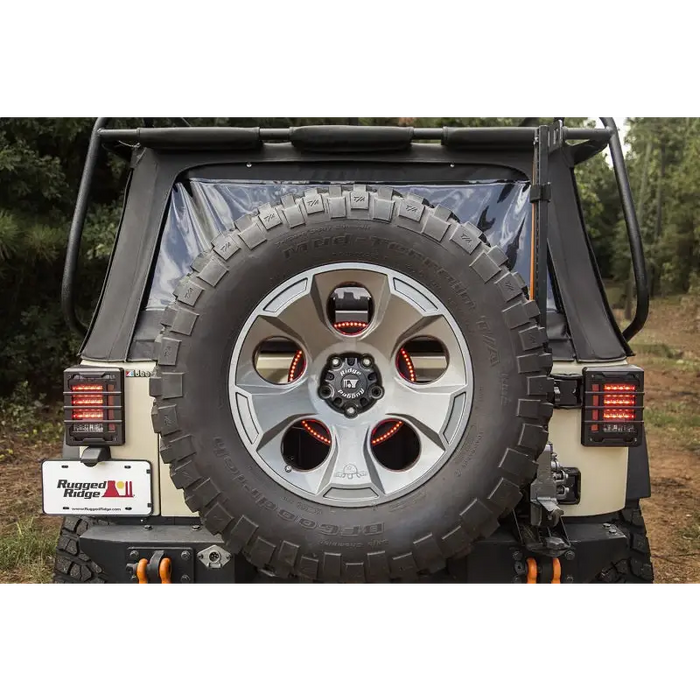 Rugged Ridge 3rd Brake Light LED Ring with jeep and tire in grass